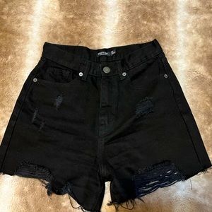 Black ripped shorts